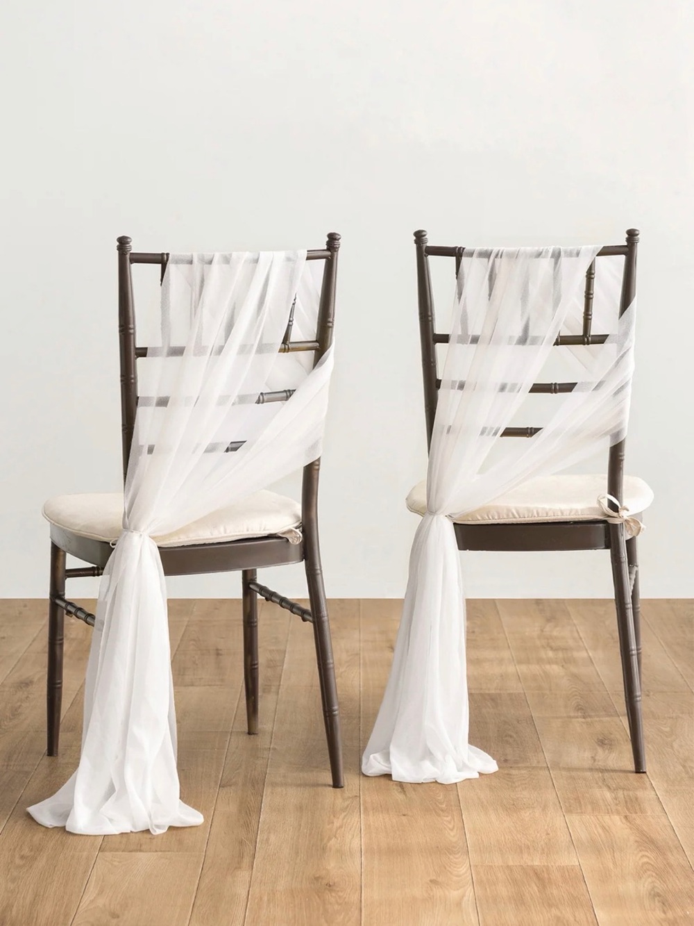 Ling’s Moment sheer white chair drapes